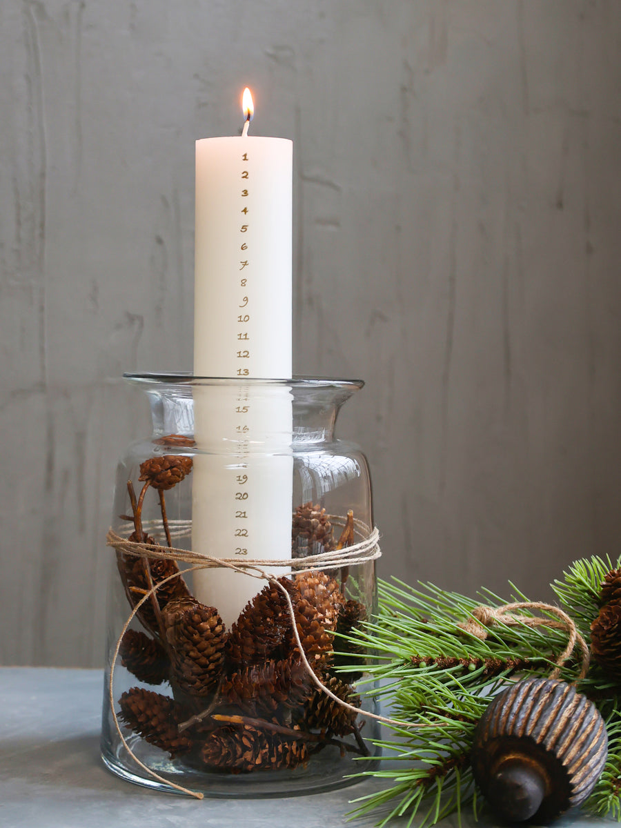 Advent Candle in glass jar with fir cones and string