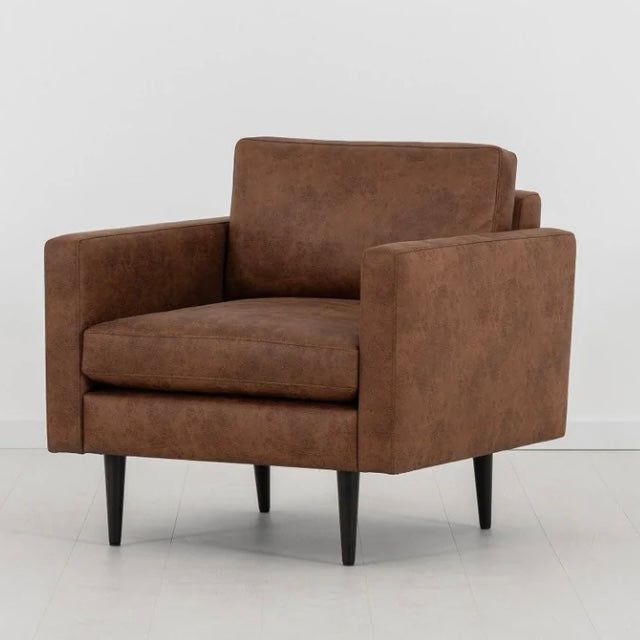 Swyft Armchair in Faux Chestnut Brown Leather in white room