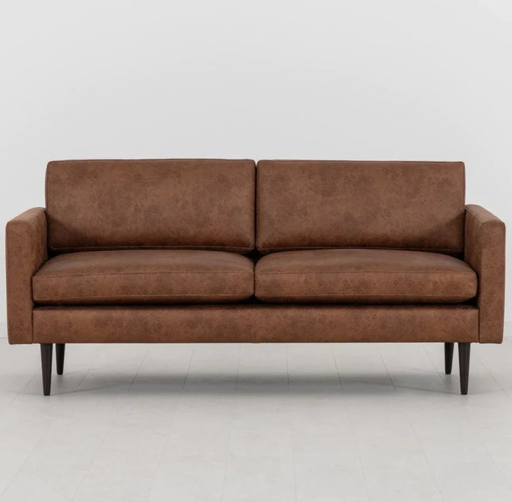 Swyft Sofa Model 01 in Faux brown leather on white background